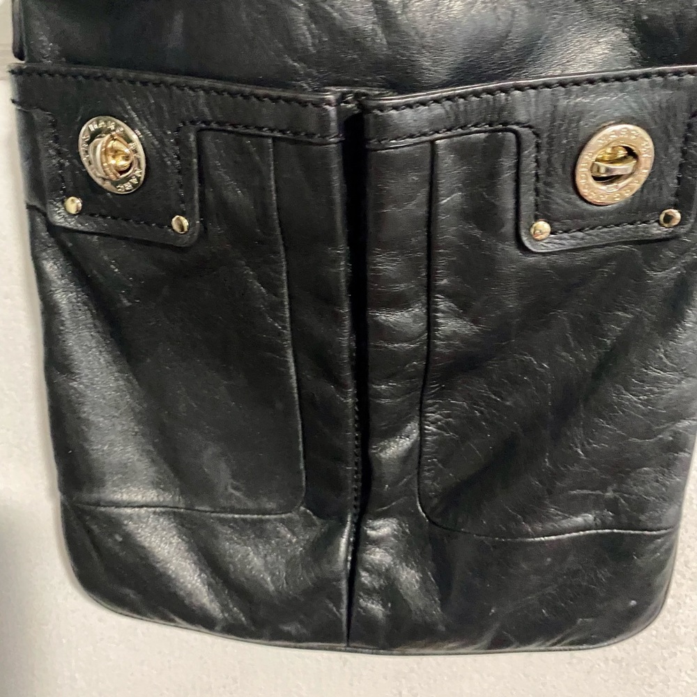 Mark Jacobs black leather crossover bag. Strap is not adjustable.
